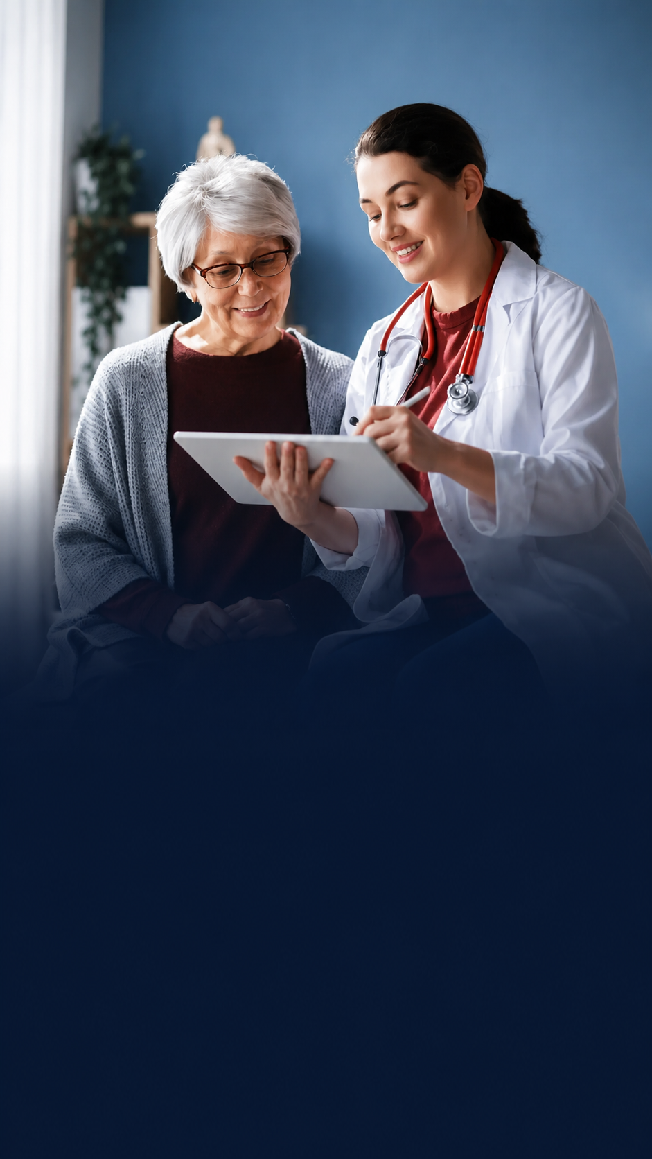 Doctor reviewing a tablet with a senior patient